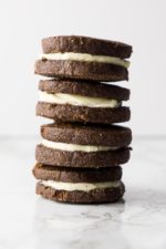 stack of 4 chocolate "oreo" sandwich cookies made keto with almond flour on a white background