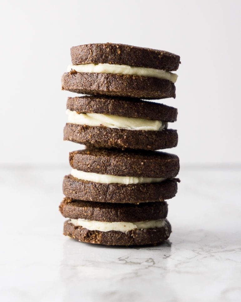 stack of 4 chocolate "oreo" sandwich cookies made keto with almond flour on a white background