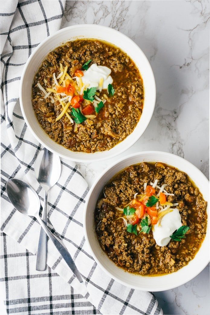 bowls of keto beef chili with sour cream