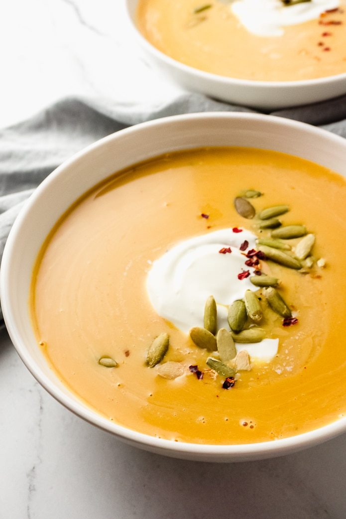 easy keto pumpkin soup in white bowls