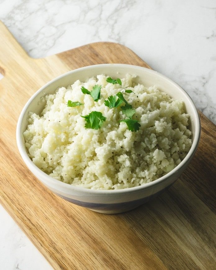 cauliflower rice in a bowl with cilantro