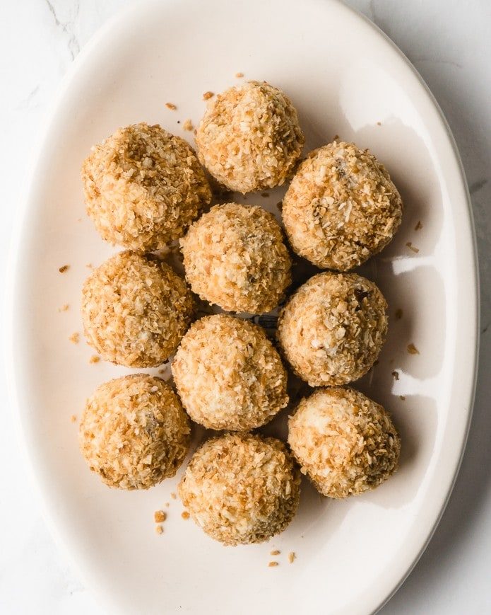 a plate of keto toasted coconut fat bombs