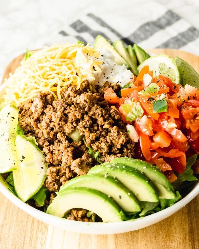 easy keto taco salad recipe made with ground beef and shredded cheese