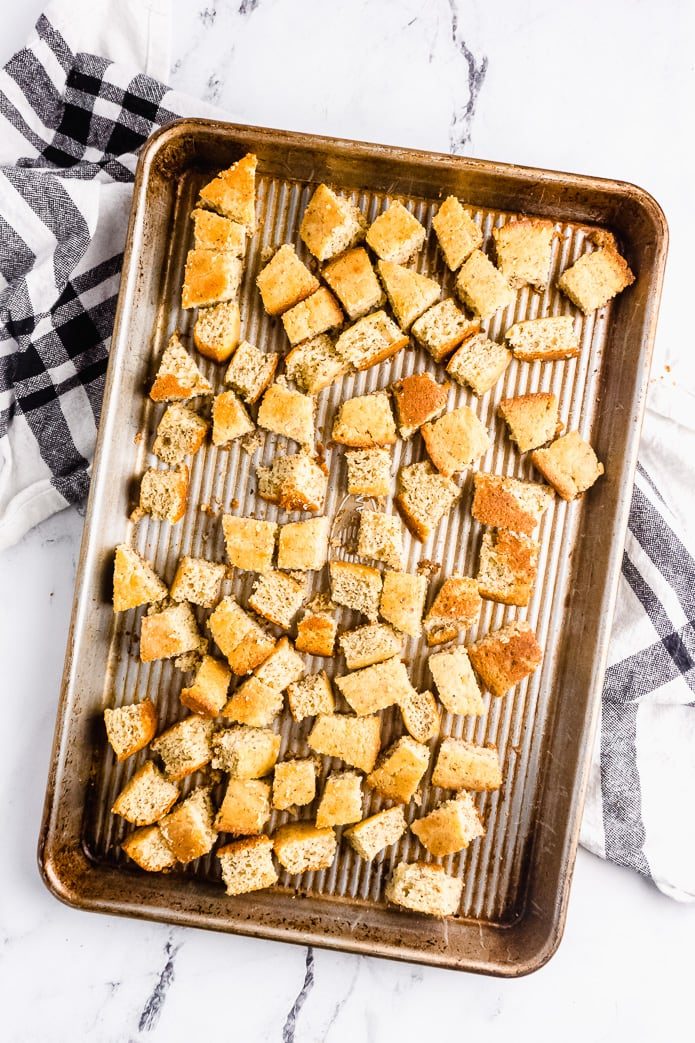 cubes of keto cornbread on a baking tray