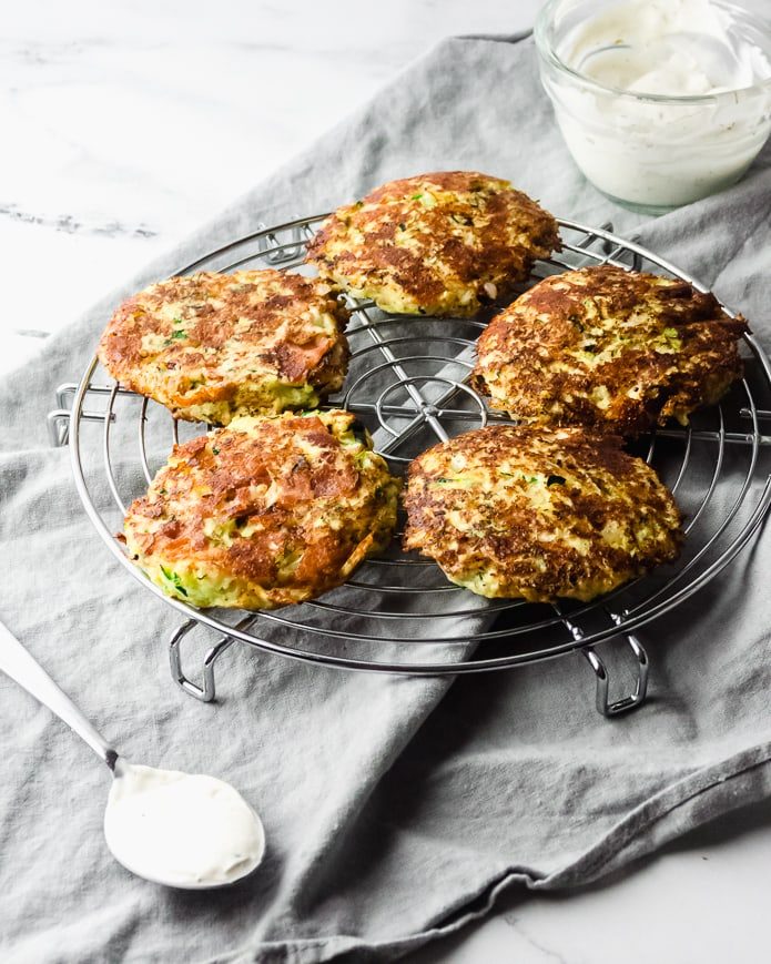 keto zucchini fritters with bacon on a cooling rack