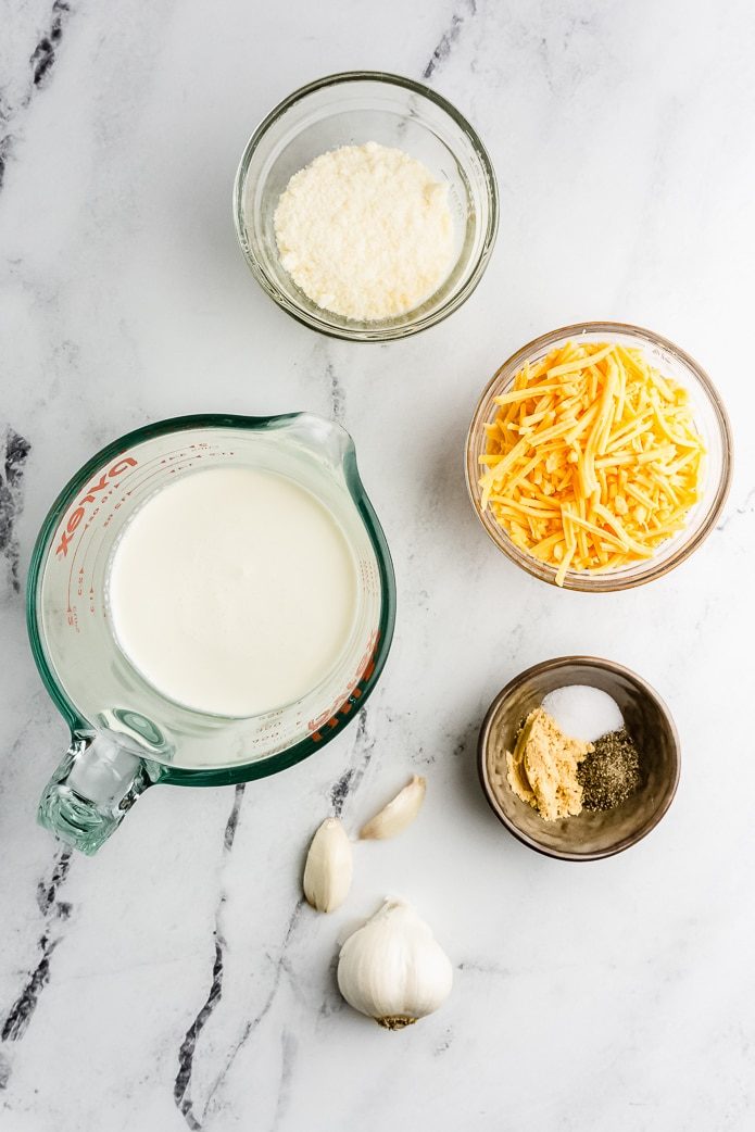 ingredients for keto cheese sauce are heavy cream, cheddar cheese, and seasonings