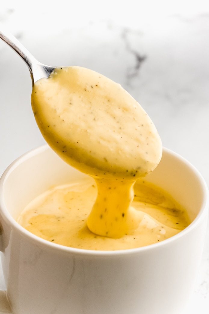 easy keto cheese sauce on a spoon