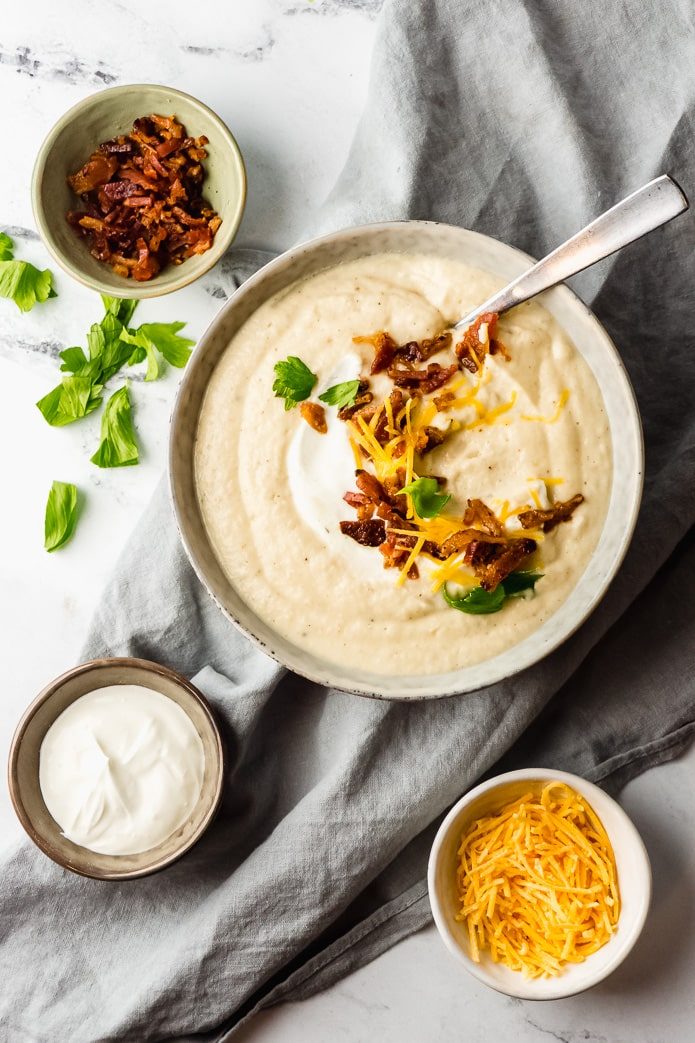 ingredients for roasted cauliflower soup are keto bacon, low carb cheese, and cream