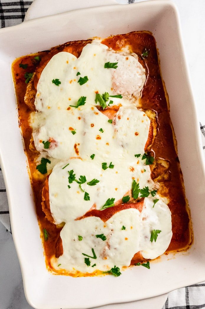 baked keto chicken parmesan with cheese and tomato sauce