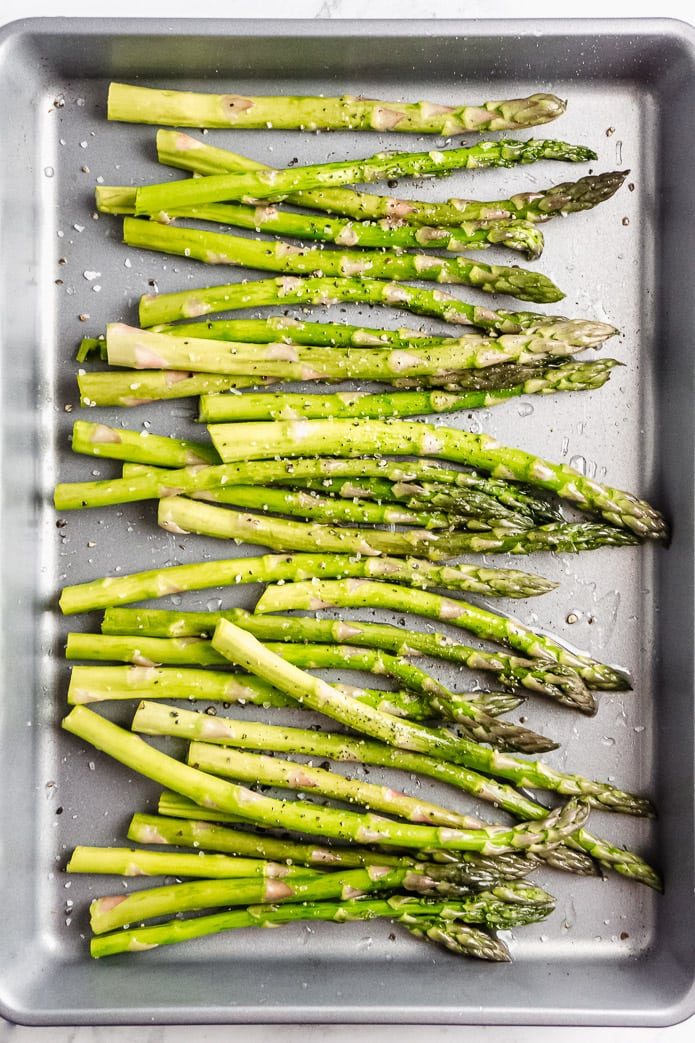 healthy keto oven roasted asparagus on a baking pan